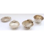 Two hallmarked silver shell shaped dishes, a hallmarked silver bowl with crimped edge and embossed