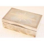 Geo.V hallmarked silver cigarette box, with engine turned starburst decoration to front with
