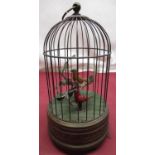 C20th musical bird cage automaton, brass cage with two birds on a branch, the base embossed with