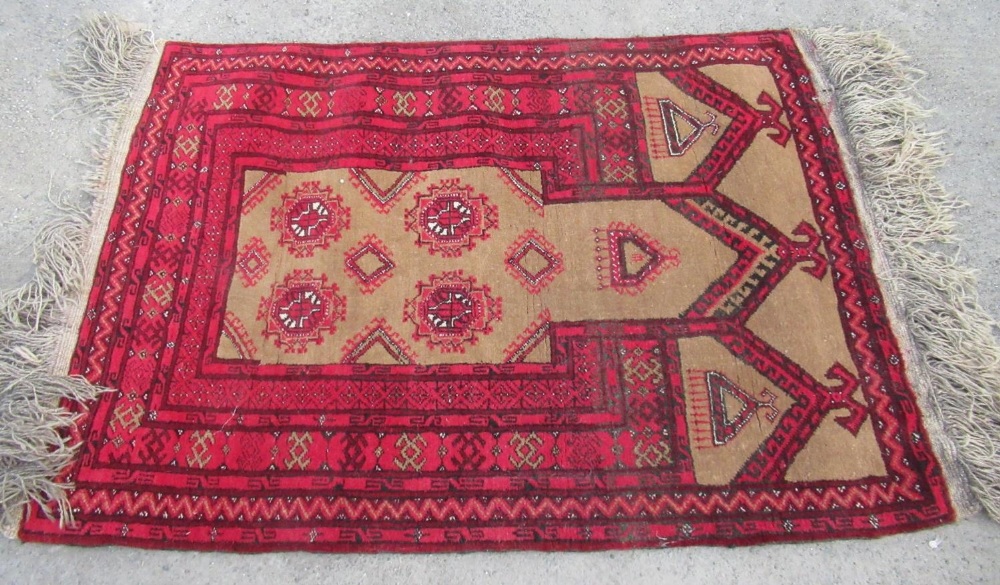 Small Persian pattern red ground Prayer rug, geometric medallion field in striped border