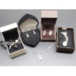 Hallmarked sterling silver pendant set with single diamond, on silver chain, and matching