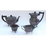Geo.V hallmarked silver four piece tea service of elongated octagonal shape on four paw feet with