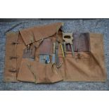 A roll up canvas field butchers set stamped "WD 1948". Includes saws, knives, cleaver etc. Rolled