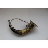 Large hunting horn made from cows horn with metal trumpet and mouthpiece, with two badges
