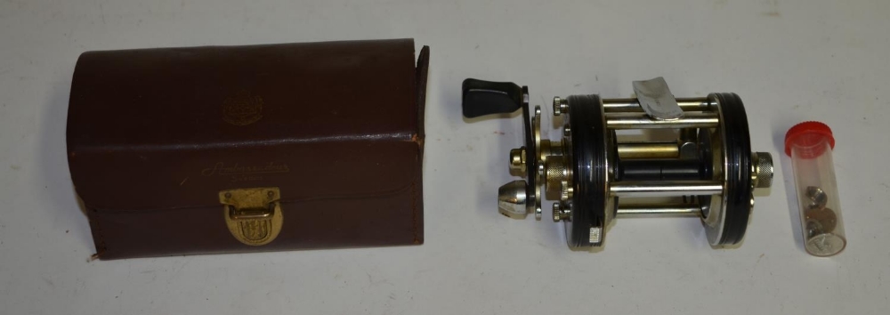 An Abu Ambassadeur 6000C multiplier reel in leather case.