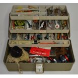 A tackle box filled with lures, flies, Devon Minnows, line and accessories, a Daiwa 735 side-arm