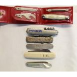 Collection of pocket knives of various styles including Rogers of Sheffield pruning knife, Woodville
