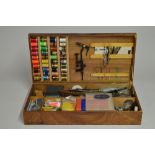 An extremely comprehensive fly tying set including 2 table top fly vices, feathers, coloured thread,