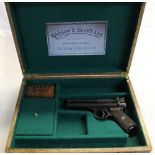 Webley Premier air pistol with Webley oil tin and pellet box (empty), in wooden case with green