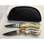 Pair of Franklin Mint pocket knives with ornate engraving to brassware, depicting pike in river