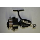 A Garcia Mitchell 300 side arm fishing reel with spare spool and brown leather bag. Reel in