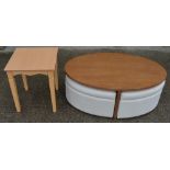 An oval coffee table with 4 pull out padded seats, each with storage space inside. Table dimensions: