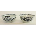 Near pair of C18th English blue and white porcelain slop bowls painted in a Bird on a Branch