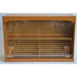 A wood display case with sliding front glass panels. Homemade removeable stepped structure ideal for