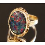 9ct yellow gold ring set with large faux opal, stamped 9ct, size P, 4.0g