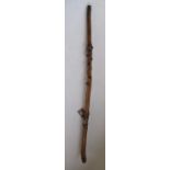 Victorian naïve walking stick, handle carved as a male face with glass eyes, all over penwork