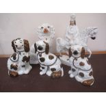 Three Staffordshire type spaniels with lustre decoration, another white spaniel and figure on