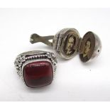 Silver Indonesian style ring set with cabochon red stone, stamped 925, and an early c20th silver orb