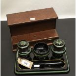 Victorian onyx glass desk stand with two integrated ink wells, central recessed pen tray with