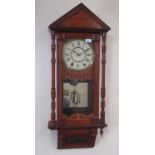 Early C20th American Vienna style walnut cased wall clock, architectural pediment over glazed