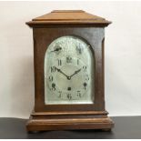 Early C20th oak cased mantel clock, arched glazed door enclosing silvered and engraved arched Arabic