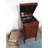 C20th HMV mahogany cased cabinet gramophone, hinged top above two doors, on square supports, with