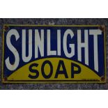 An enameled steel plate advertising sign for Sunlight Soap. W48xH27.1cm