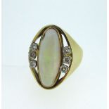 18ct yellow gold ring set with oval cut opal and six brilliant cut diamonds, stamped 750, size N1/2,