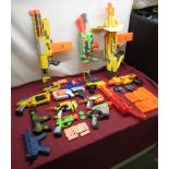13 Nerf Guns with accessories and foam projectiles with 2 toy guns