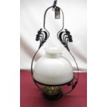 C20th hanging oil lamp with steel strapwork frame with Art Nouveau motifs, brass reservoir with