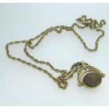 9ct yellow gold revolving pendant set with bloodstone and moss agate, stamped 375, on a 9ct yellow