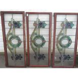 Three leaded stained glass window panels, decorated with scrolling foliage, W50cm H115cm (3)