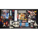 Collection of Transformers toys, books and cassette tapes