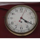 C20th brass bulkhead type clock, circular white Arabic dial with red 24hr numerals and seconds