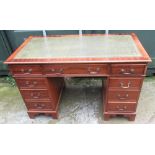 C20th mahogany twin pedestal desk with inset tooled and gilded leather writing surface, over