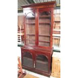Victorian mahogany bookcase, with moulded cornice above four glazed doors, W135cm D55cm H265cm