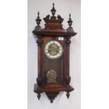 Early C20th continental Vienna style walnut cased wall clock, carved pediment with turned finials,