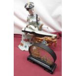 Chinese model of a seated female playing a string instrument, H39cm a souvenir carved model of a