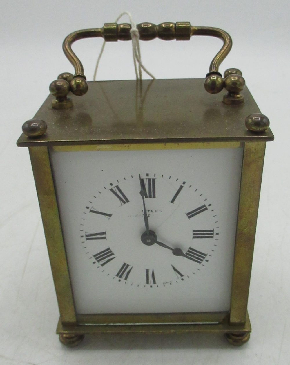 Early 20th century French brass cased carriage clock timepiece with white enamelled dial bearing