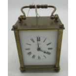 Early 20th century French brass cased carriage clock timepiece with white enamelled dial bearing