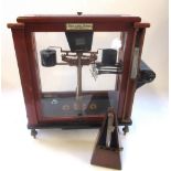 Set of C20th L.Obertling Release-o-matic Balance scales in mahogany case, W43cm D24cm H50cm and a