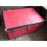 Large red trunk containing various clothing incl. Hunting jacket with gilt buttons, Devlin & Co.