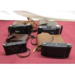 Coronet folding camera with F7.7 lens and case, Kodak Brownie folding camera patented March 4th 1902