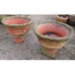 Reconstituted stone terracotta effect urns with fruit and floral design