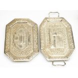 C20th Indian white metal canted rectangular two handled tray, centre relief decorated with a