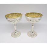 Pair of ER.11 hallmarked silver C18th style goblets, hammered bowls with gilt interior, on knopped