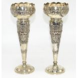 Pair of C20th Indian white metal trumpet shaped vases, with waived and pierced rims and animals in