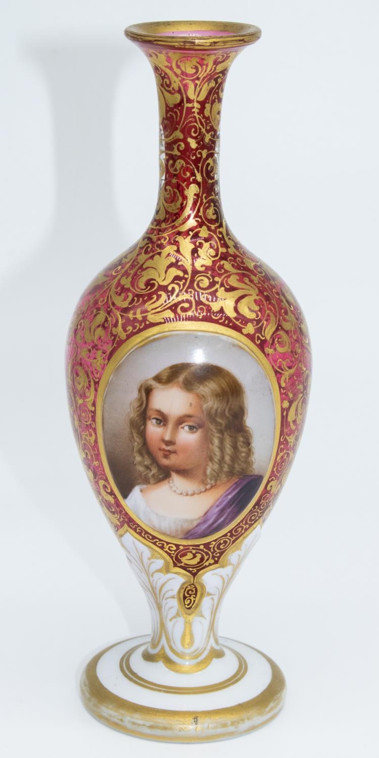 C19th Bohemian cranberry glass vase, the ovoid body with painted ovals of a young girl and a still