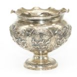 C20th white metal pedestal bowl, decorated with in relief with eight panels of animals, Deer,
