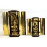 Graduated pair of Indian travelling Icons, of carved giltwood Buddha, in papier lacquered travel